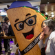 A Taco Bell mascot poses during a grand opening in 2015.